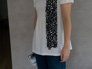 Illustration for article titled Laser-Cut Scarfs. Verdict: Fashion and Laser Beams FTW!